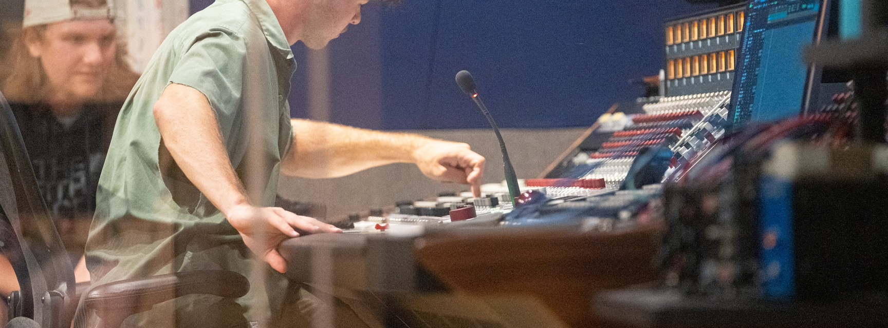 Student operating soundboard