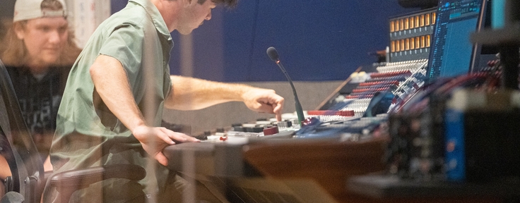 Student operating soundboard