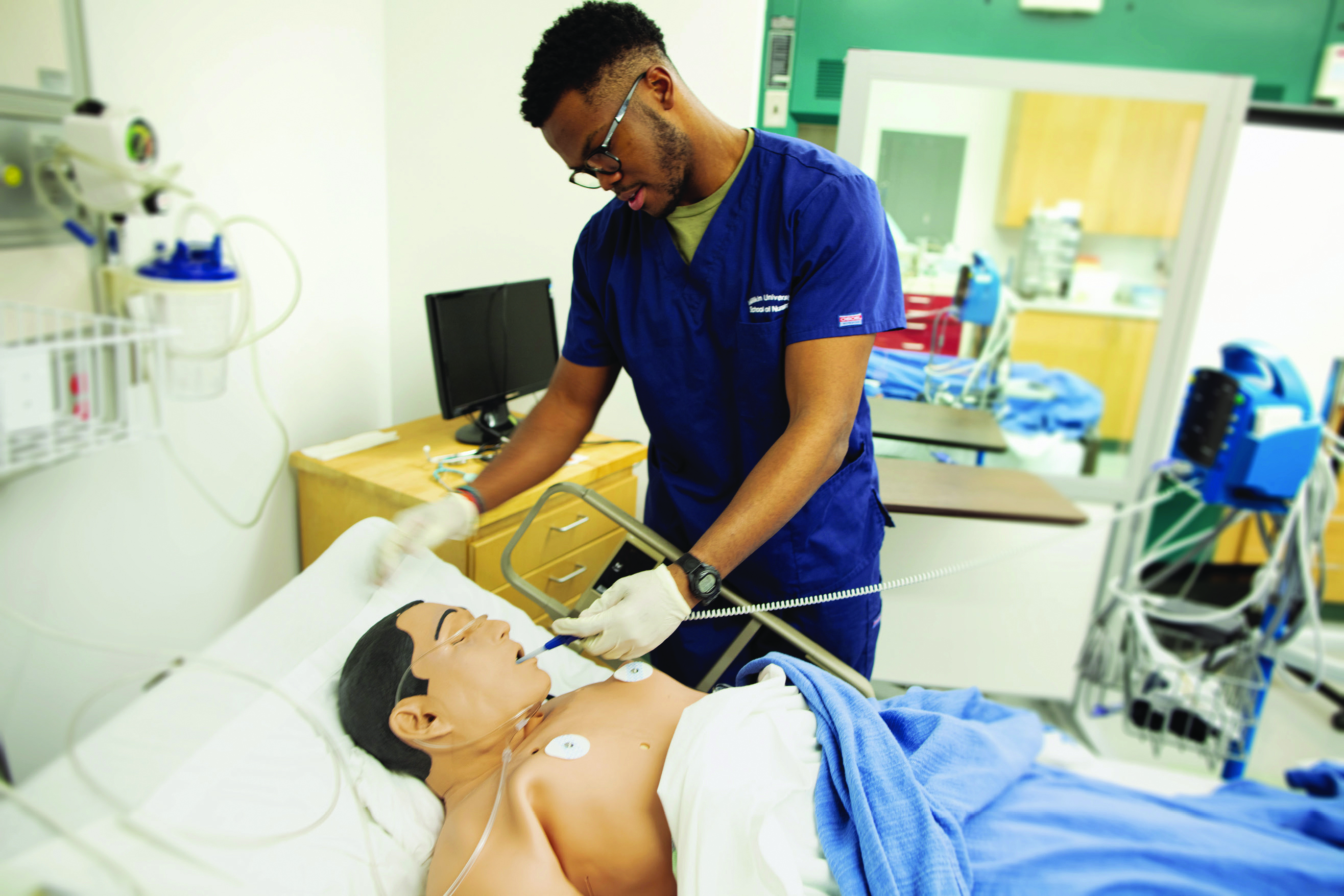 Student using medical equipment