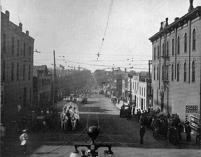 1916 Millidek image of parade up West Main St.