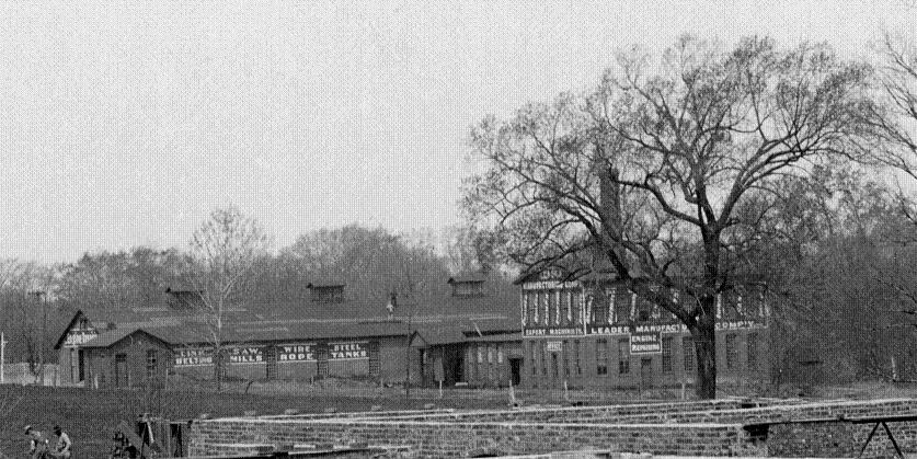 1902 Photograph showing contruction of Millikin's main building (today's Shilling Hall) in foreground and Leader Mfg at center