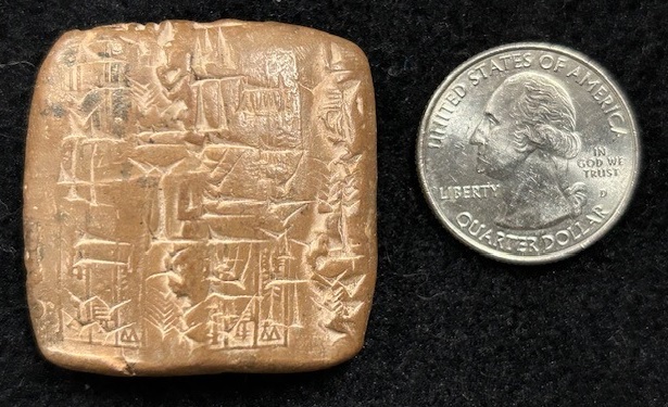 Cuneiform tablet 5, side A, depicted next to a U.S. quarter coin for scale