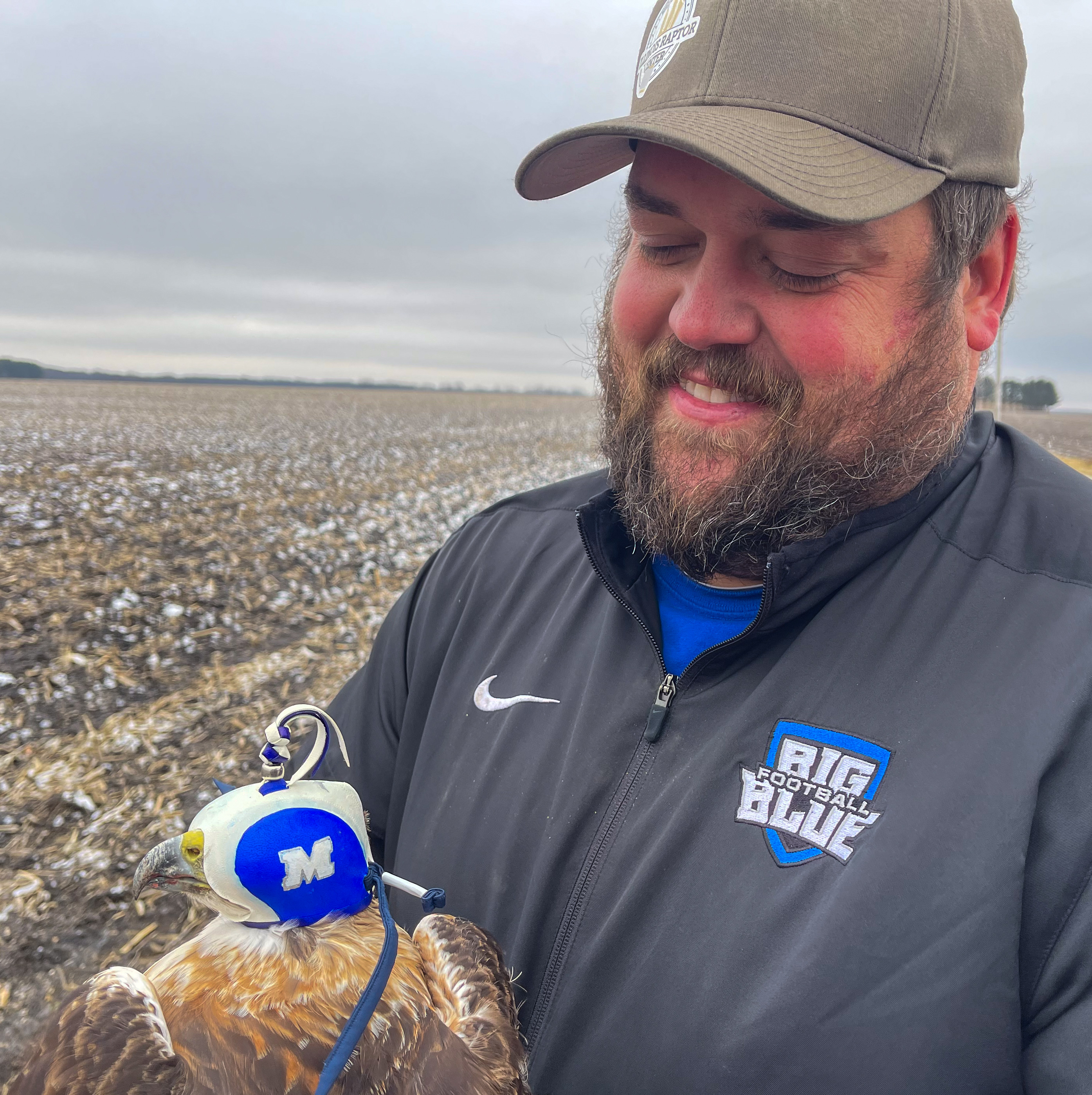 Travis Wilcoxen with raptor