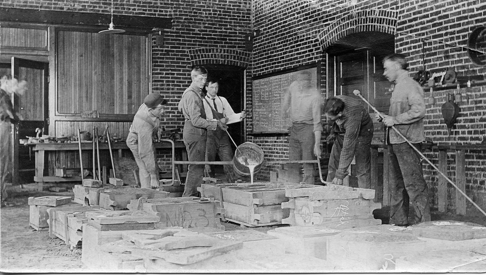 Black and white photo of working in Machinery Hall