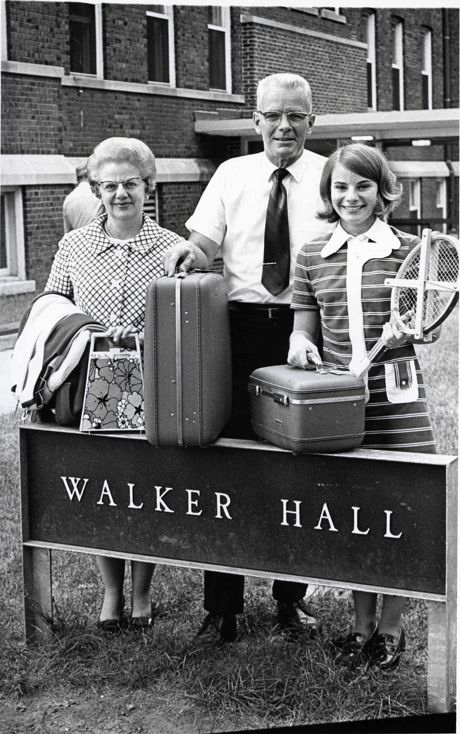 Black and white photo of students moving into Walker Hall