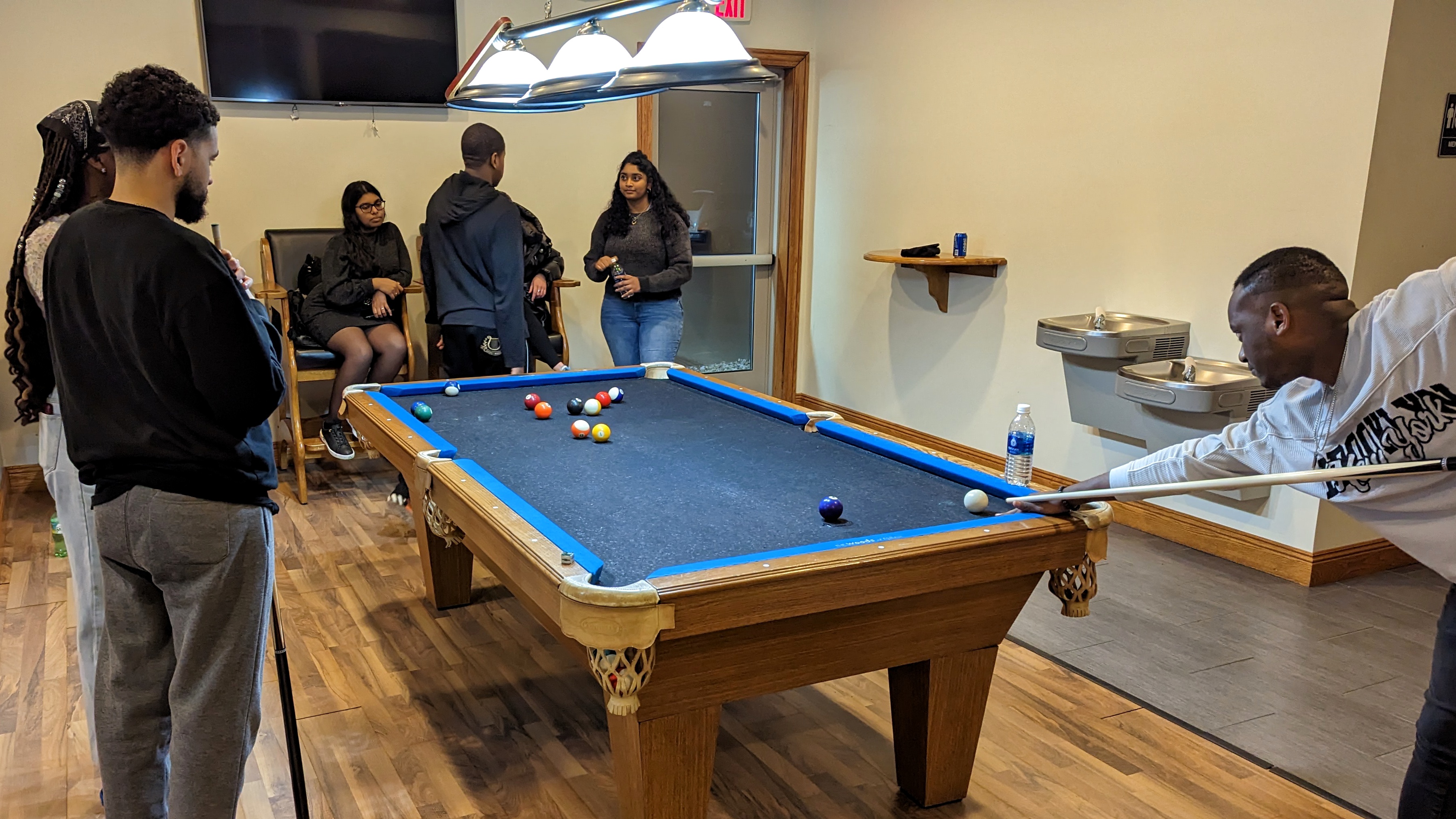 Students playing billiards