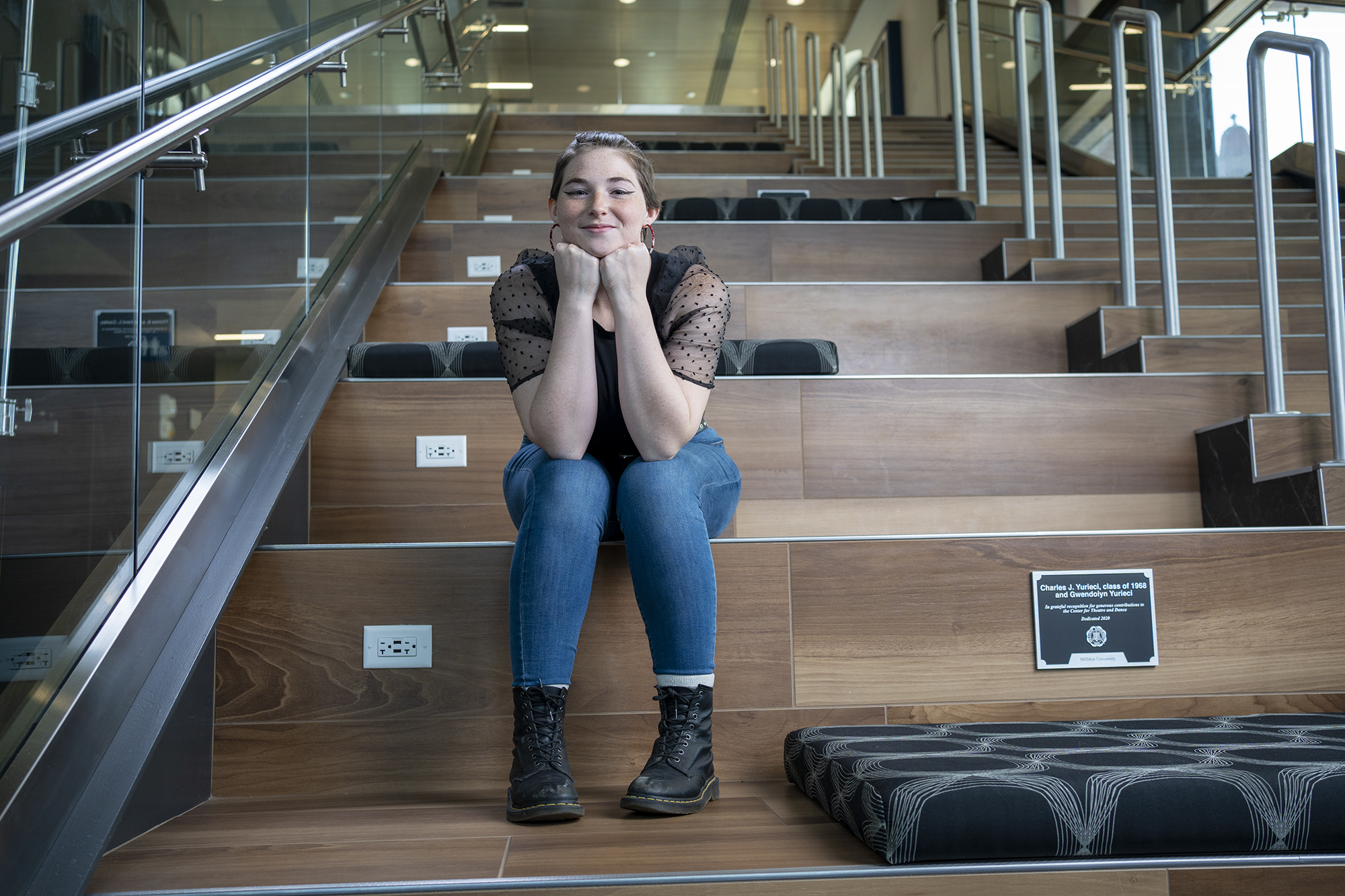 Liv Crabtree sitting on steps