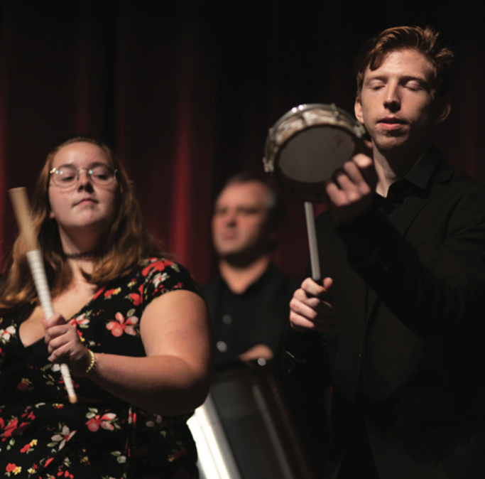 students playing percussion