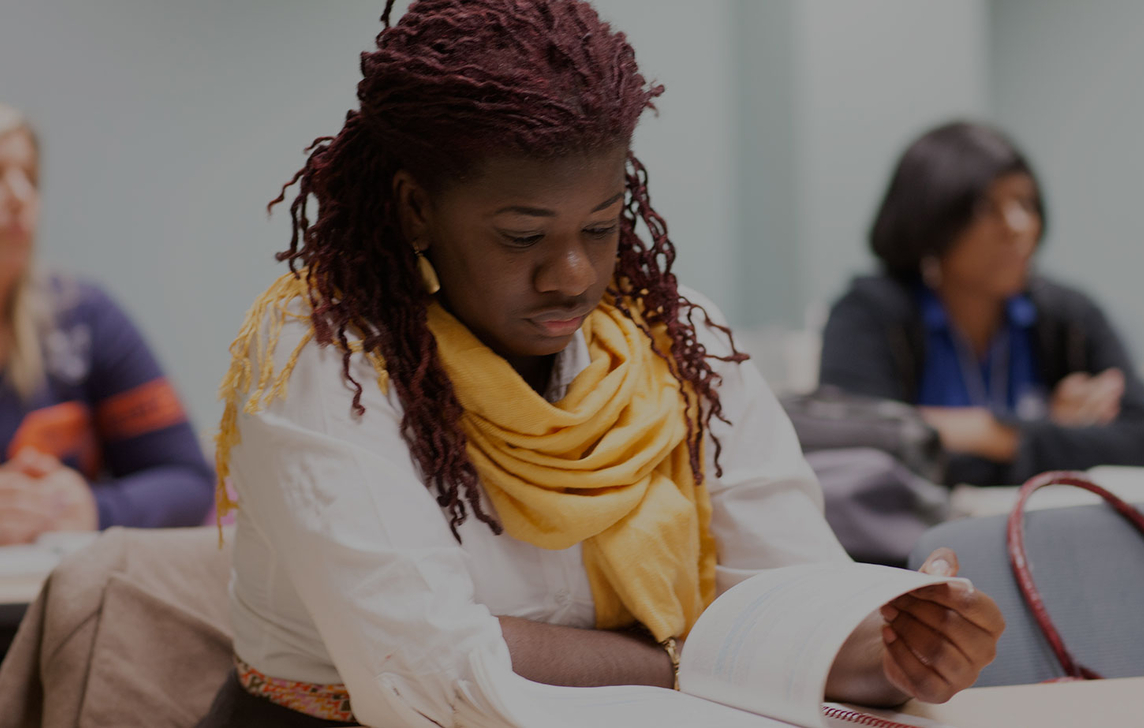 woman reading in classroom