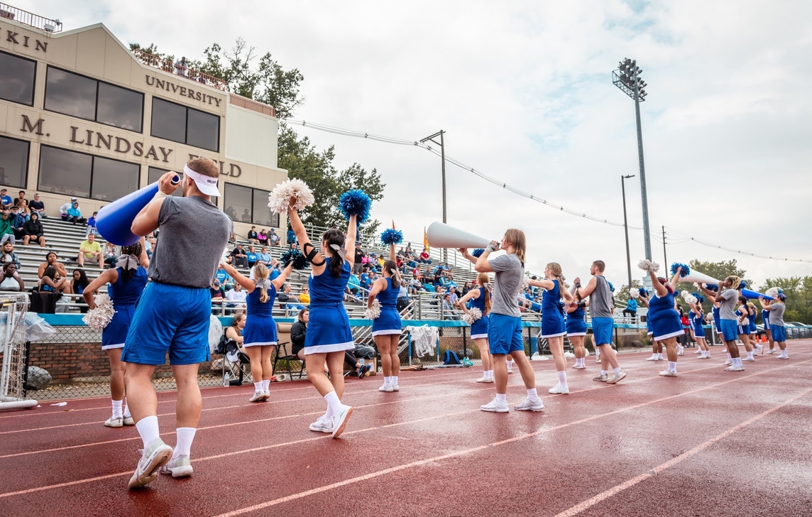 Cheerleading squad in front of fans