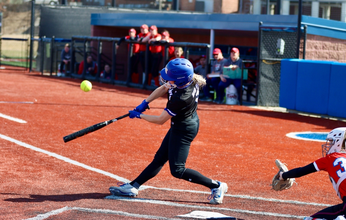 softball player batting