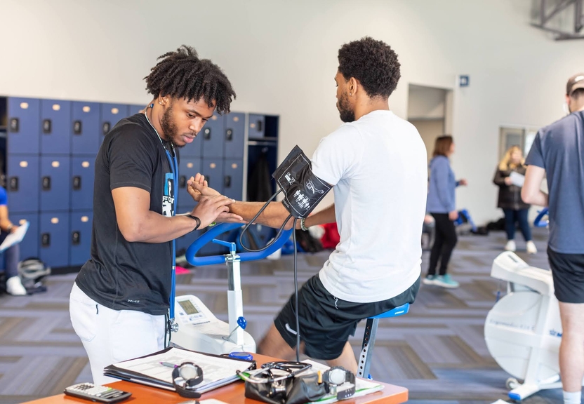 student taking blood pressure test