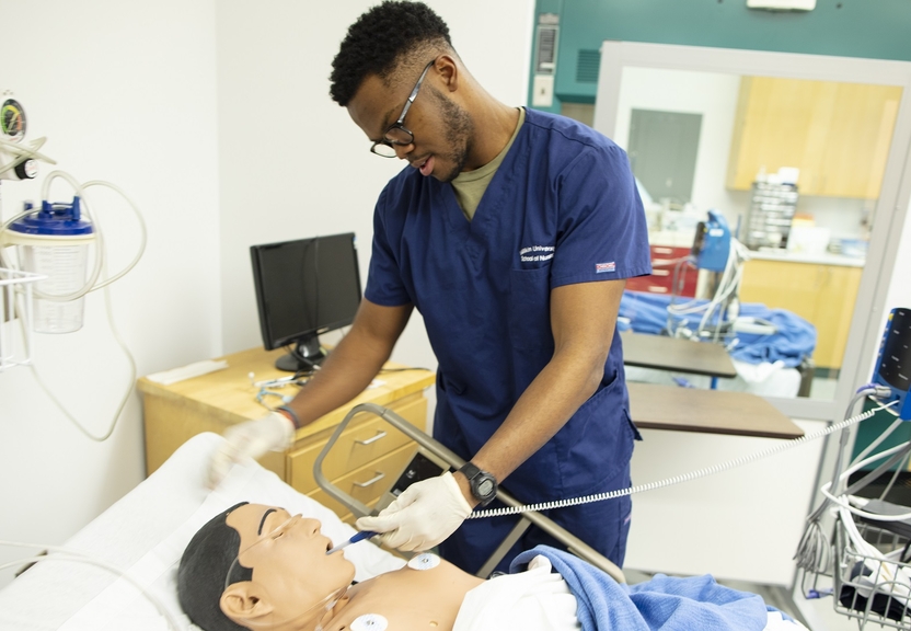 Student testing medical equipment