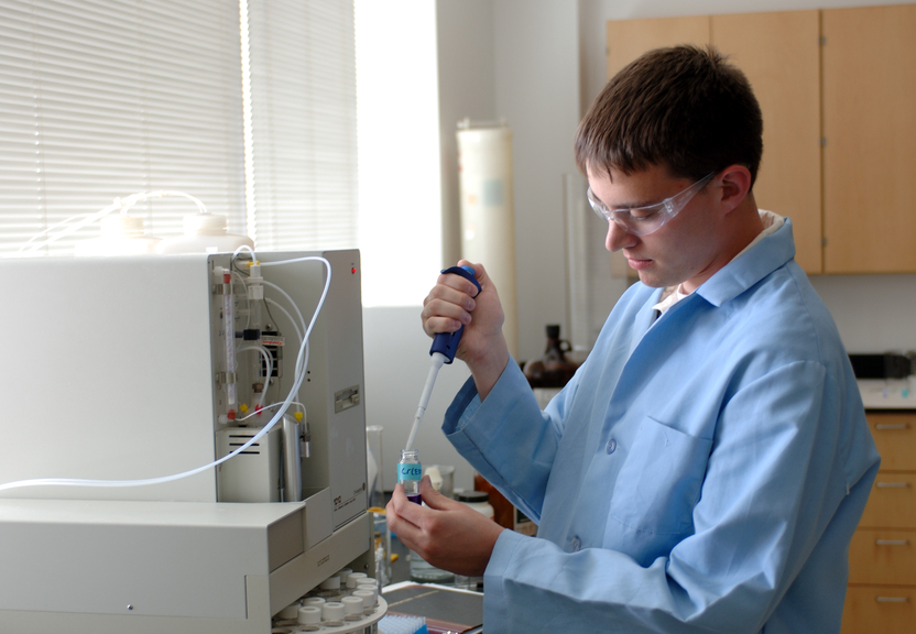 Student with lab equipment