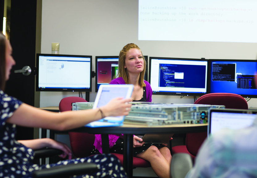 students with computer equipment