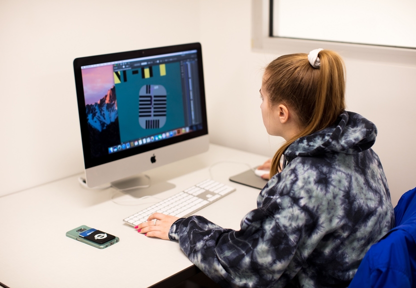 student editing an image on computer