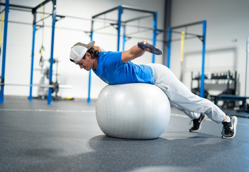 Student balancing on an exercise ball