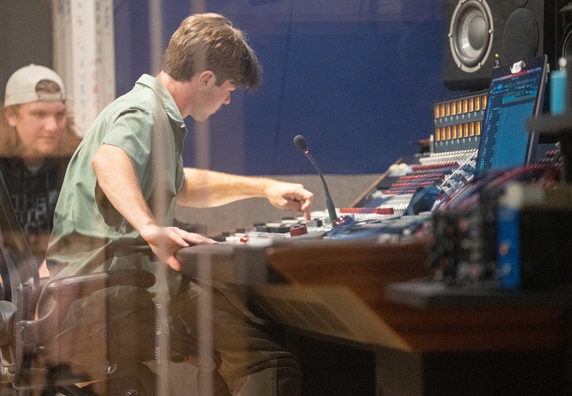 Student operating soundboard