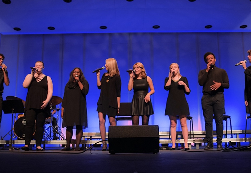 Group of performers on stage