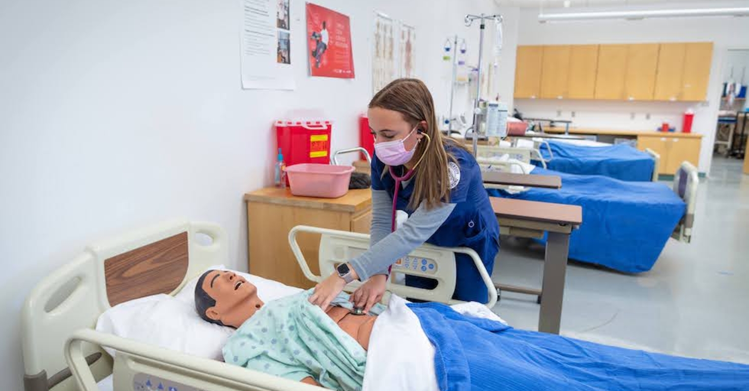 Nursing student checking heartbeat