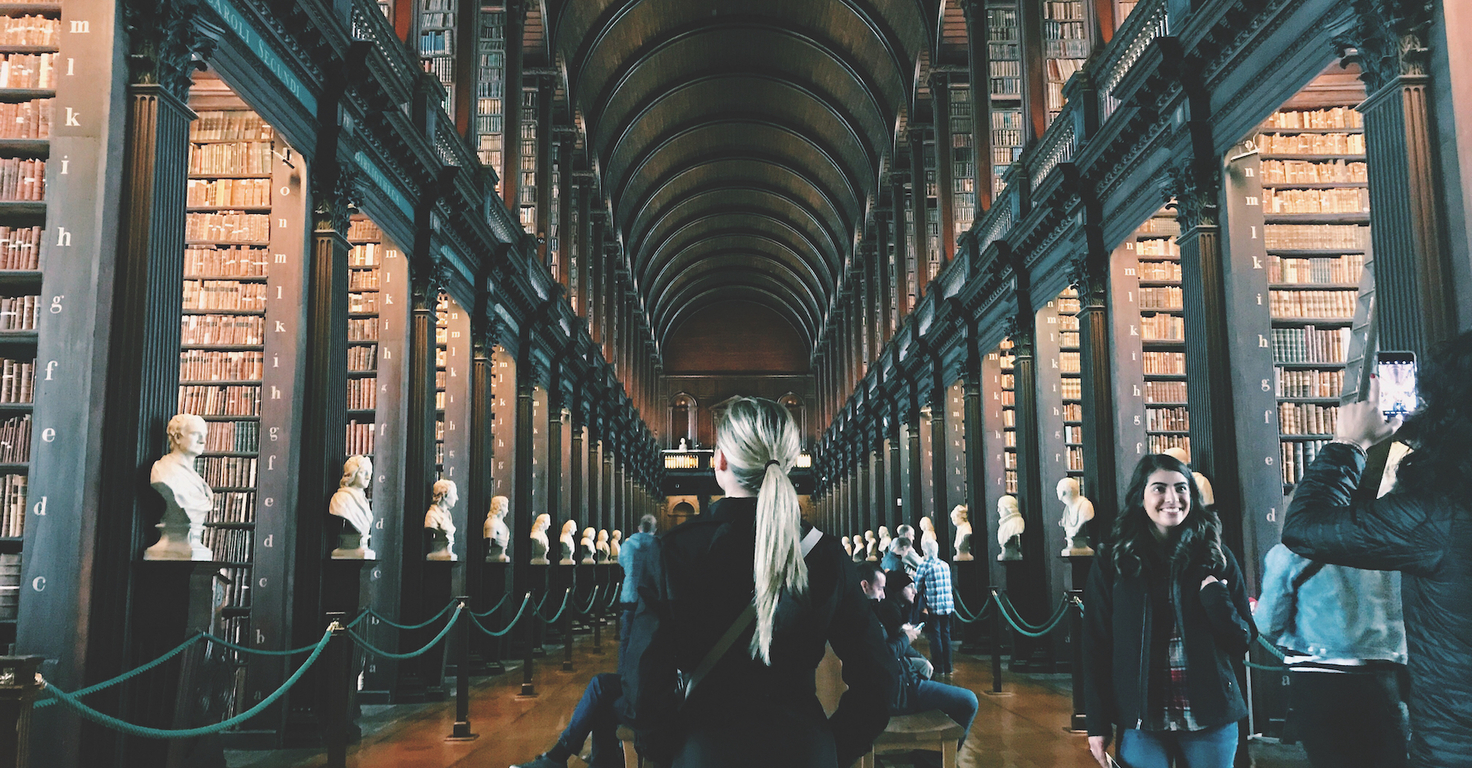 Student walking through library