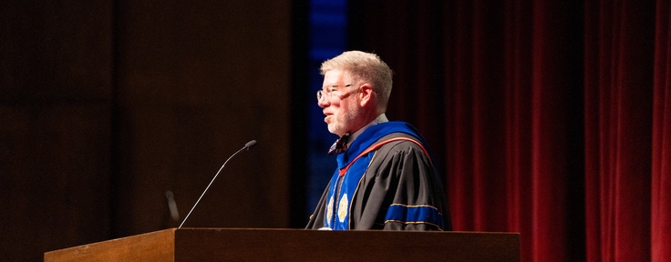 Dr. Dean Pribbenow speaking at commencement