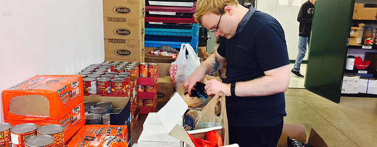 student filling bags with food