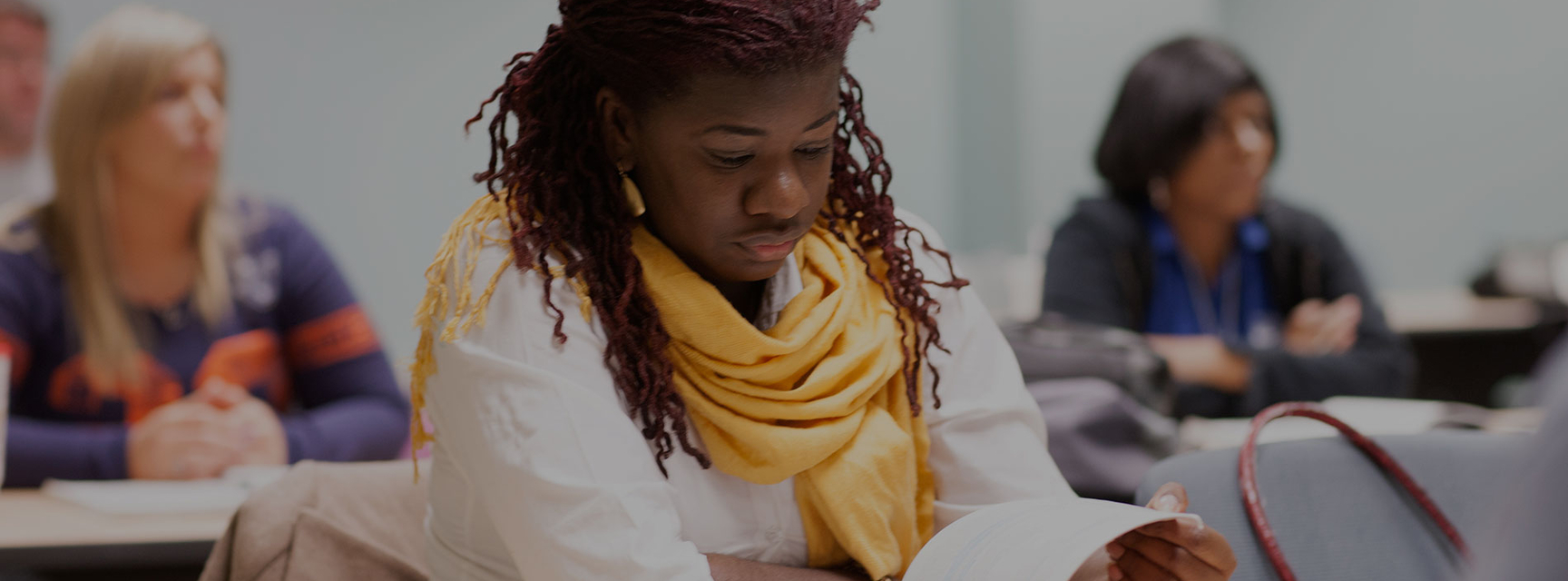 woman reading in classroom