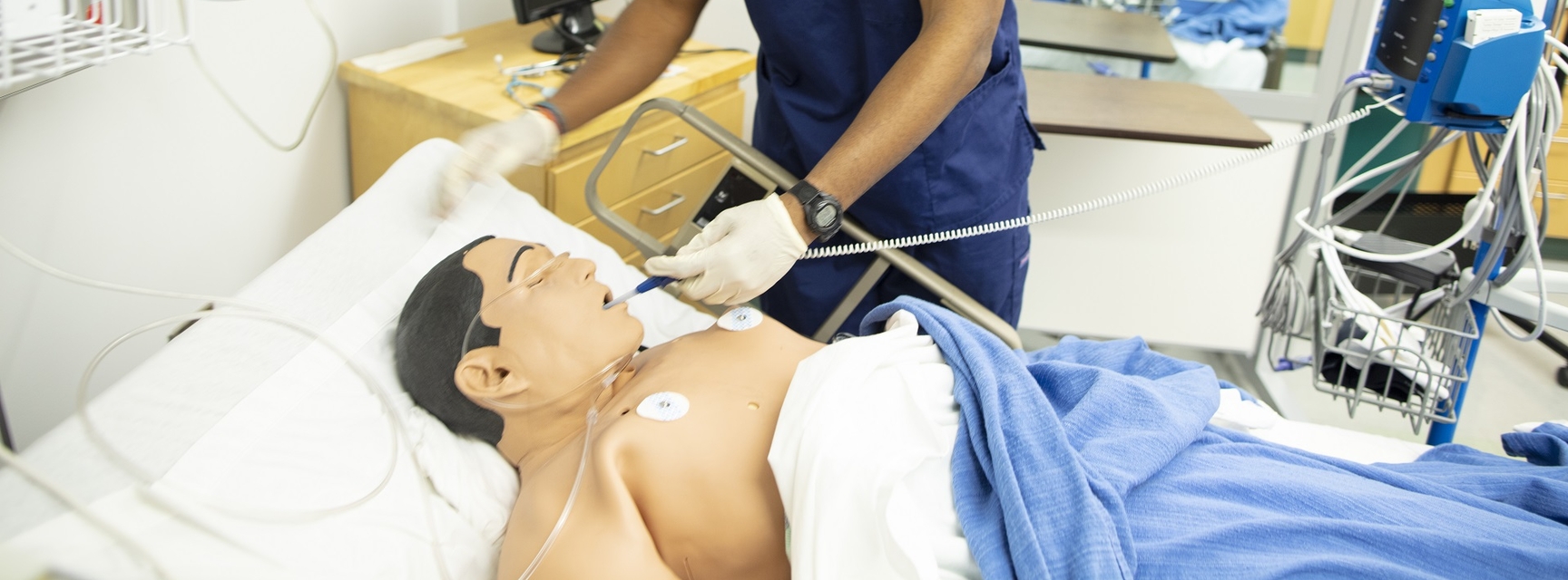 Student testing medical equipment