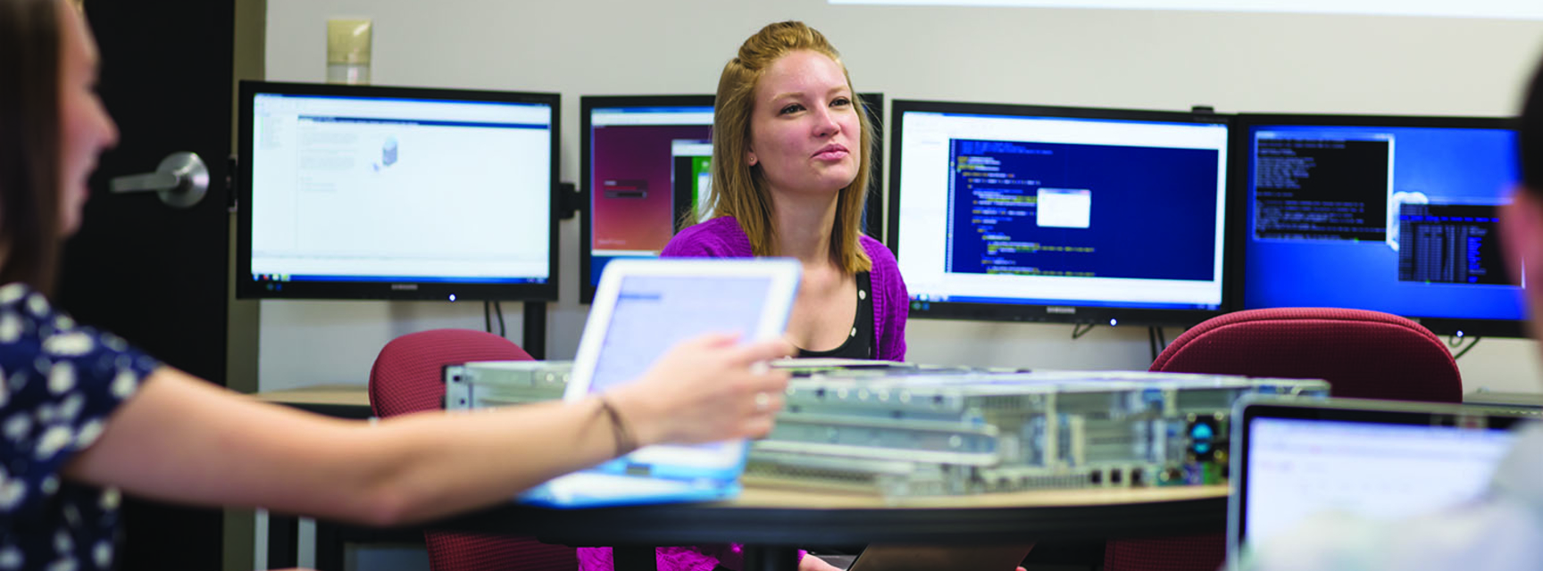 students with computer equipment
