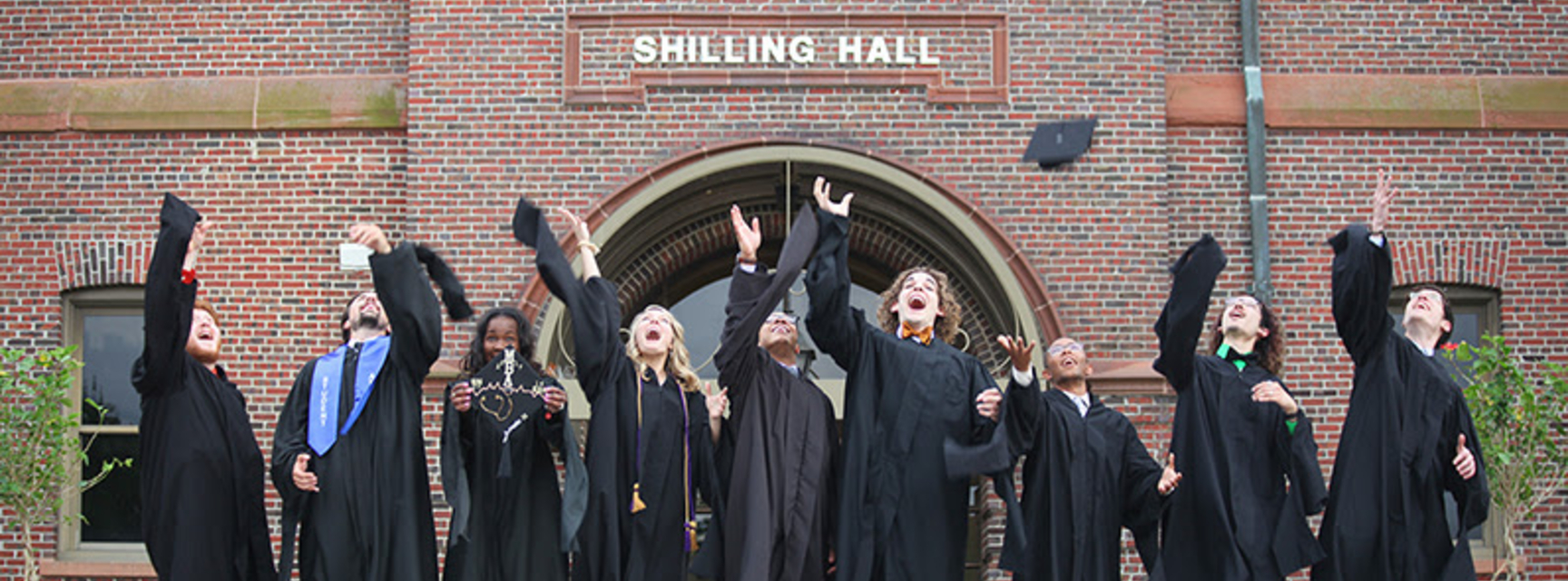 Students throwing caps in the air