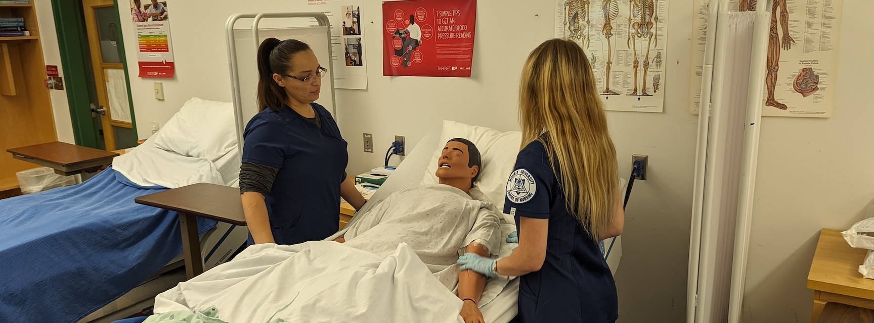 Nursing Students practicing on manikin