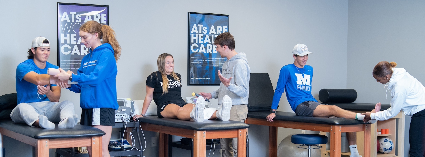 Athletics science students practicing skills
