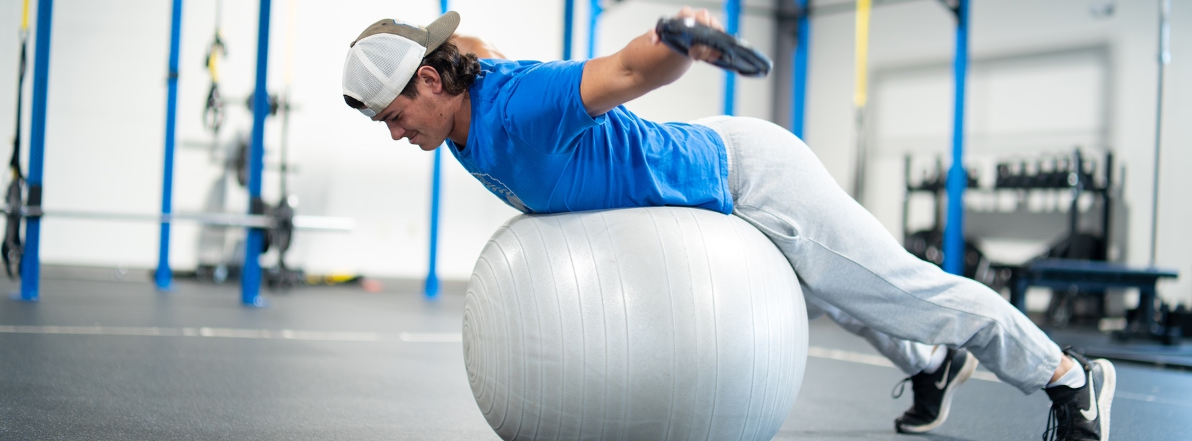 Student balancing on an exercise ball