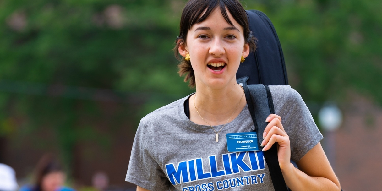 Student assisting with move in