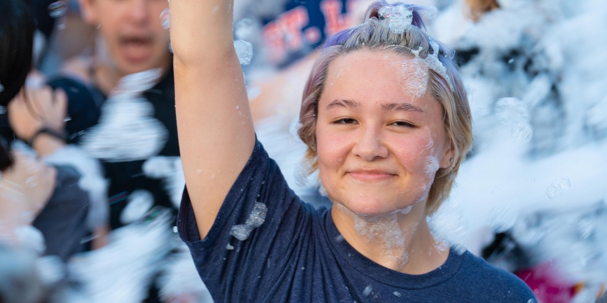 Student at foam party