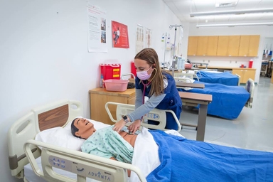 Nursing student checking heartbeat