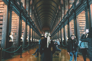 Student walking through library