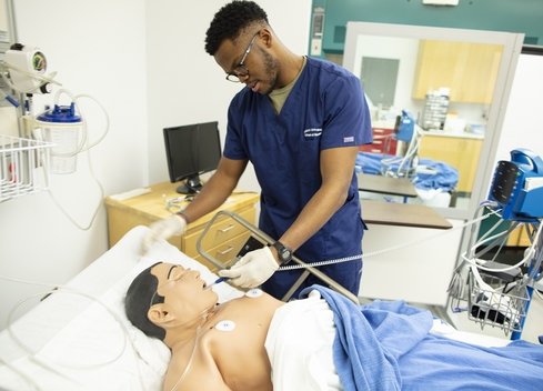 Student testing medical equipment