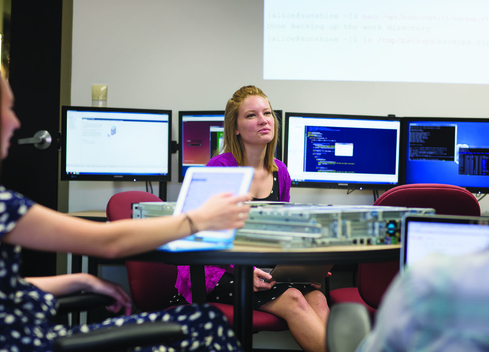 students with computer equipment