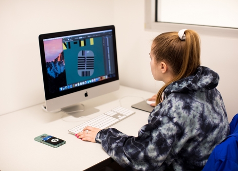 student editing an image on computer