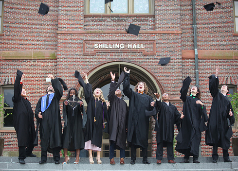 Students throwing caps in the air
