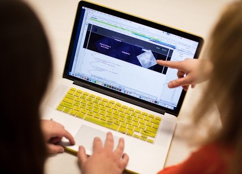 students showing work on computer