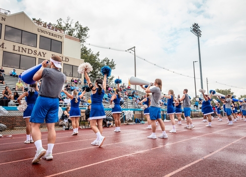 Cheerleading squad in front of fans