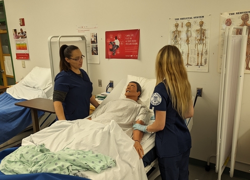 Nursing Students practicing on manikin