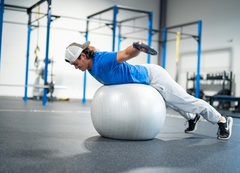 Student balancing on an exercise ball