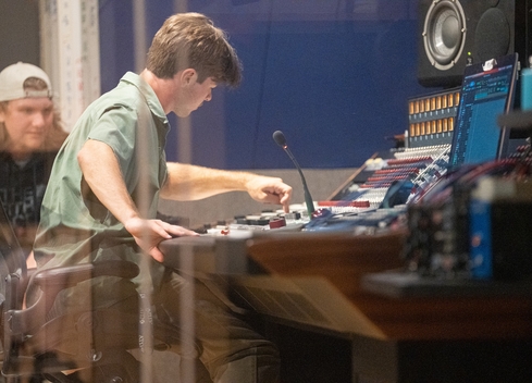 Student operating soundboard