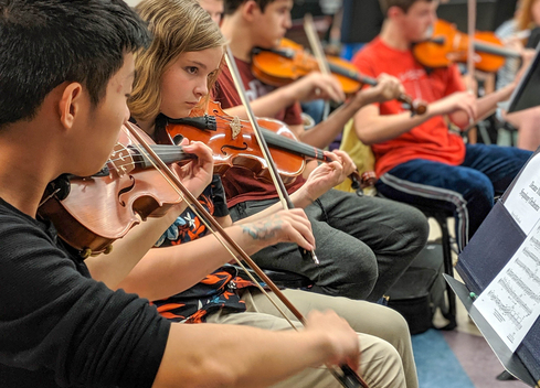 Children playing violin!