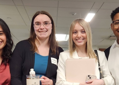 four students smiling