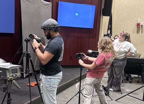 students setting up cameras